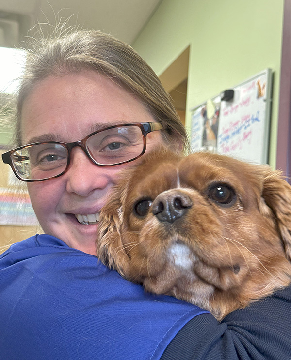 vet-hugging-dog